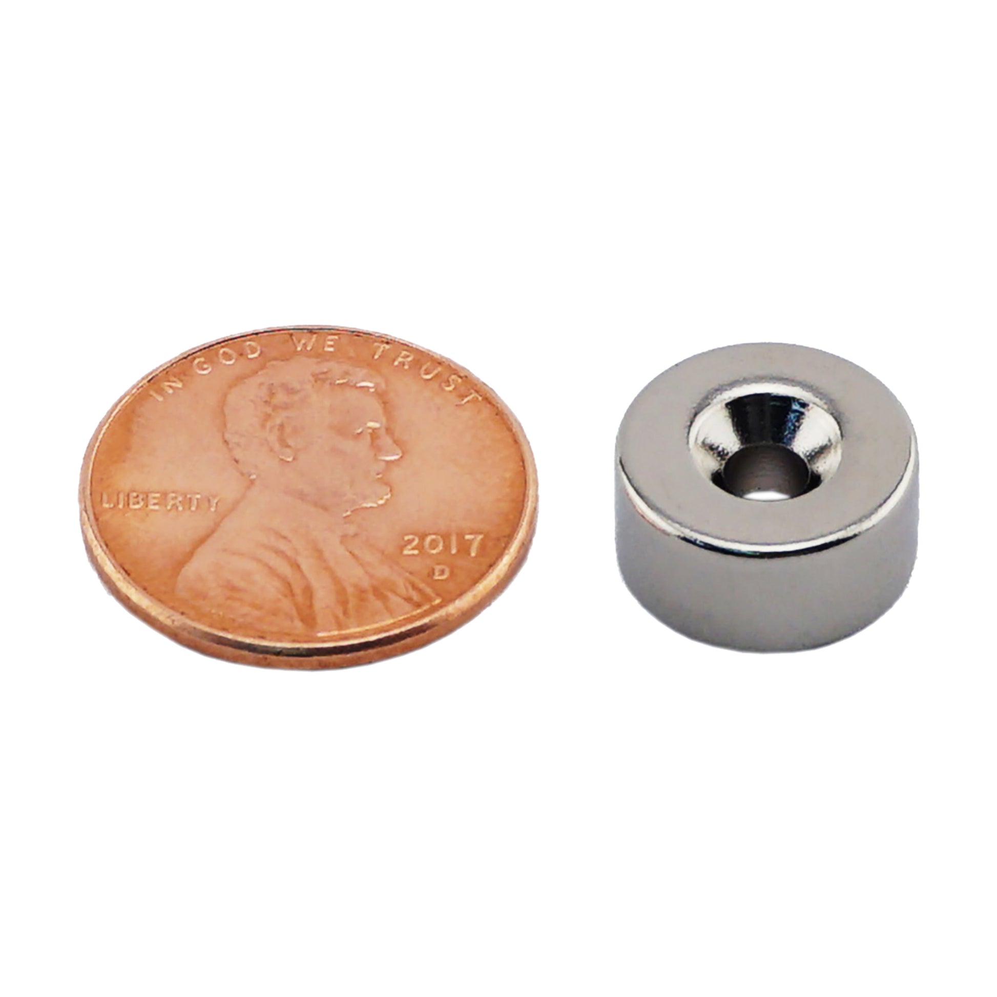 Load image into Gallery viewer, NR005020NCTS Neodymium Countersunk Ring Magnet - Compared to Penny for Size Reference