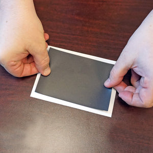 ZG203.5X5A-F Flexible Magnetic Sheet with Adhesive - Hand Placing Magnet on Surface