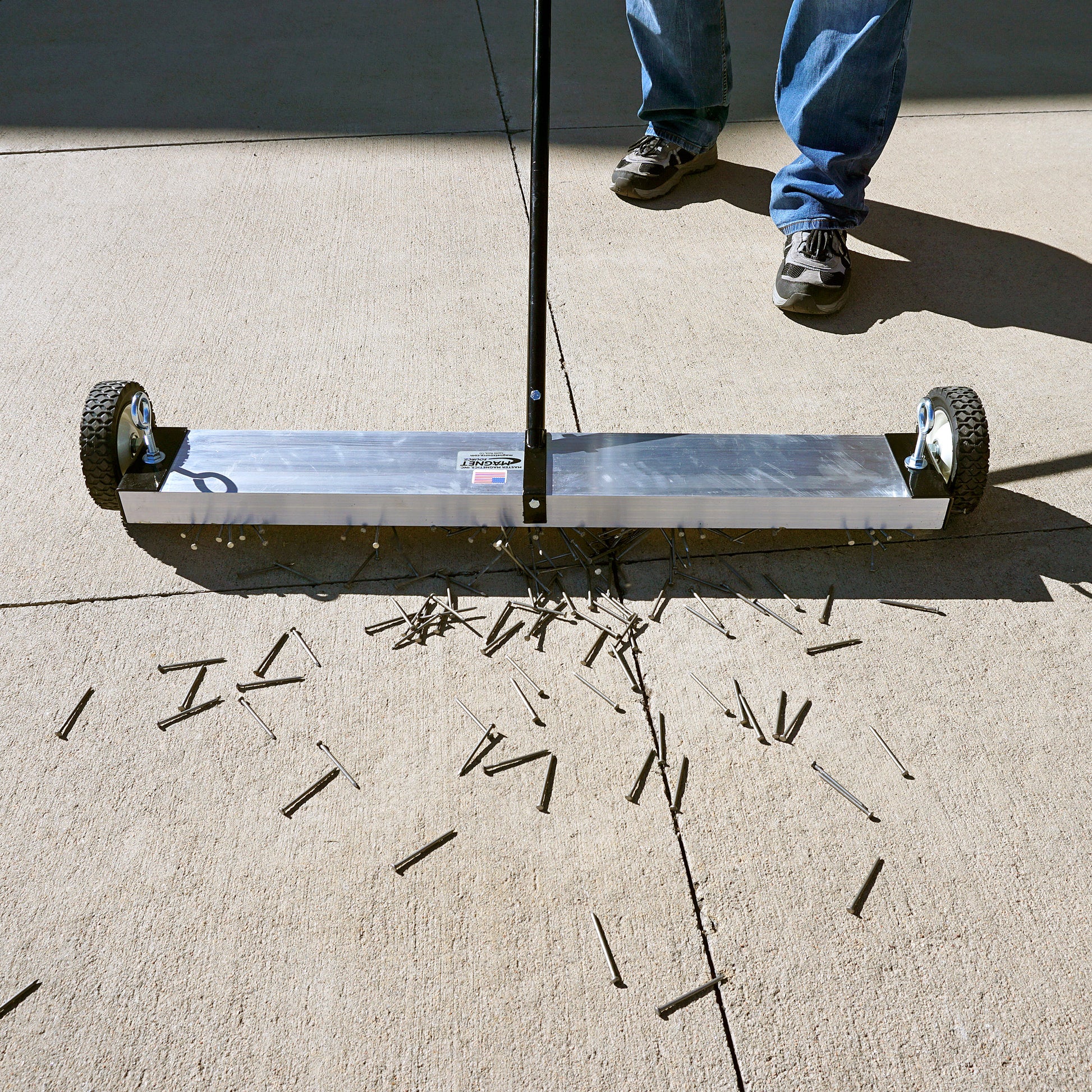 Load image into Gallery viewer, MFSM36 Magnetic Floor Sweeper - Man Sweeping Metal Debris off Sidewalk