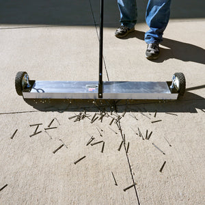 MFSM36 Magnetic Floor Sweeper - Man Sweeping Metal Debris off Sidewalk