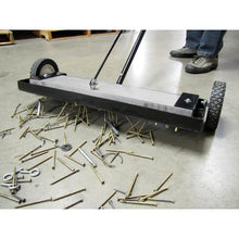 Load image into Gallery viewer, MFSM24RX Magnetic Floor Sweeper with Quick Release - Sweeper picking up metal debris on warehouse floor