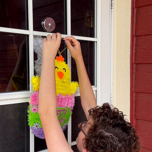 07254 Magnetic Window Decor Hooks (2pk) - Woman Placing Birthday Decoration On Magnet on Door with Windows