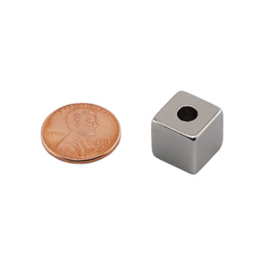 NB005057NS01 Neodymium Block Magnet with hole - Compared to Penny for Size Reference