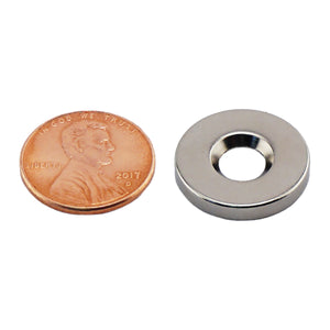 NR005019NCTS Neodymium Countersunk Ring Magnet - Compared to Penny for Size Reference