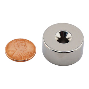 NR010022NCTS Neodymium Countersunk Ring Magnet - Compared to Penny for Size Reference