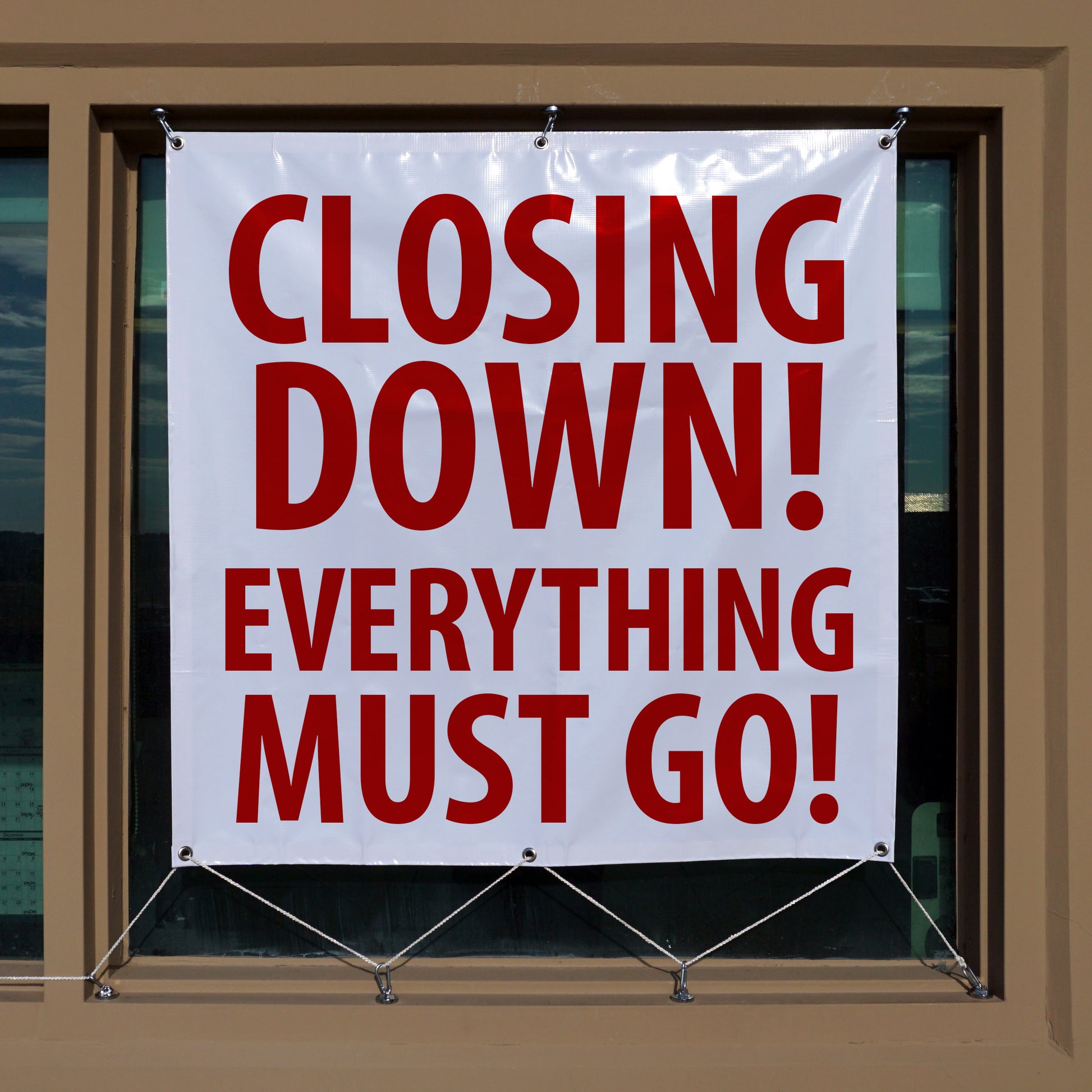Load image into Gallery viewer, 07587 Neodymium Magnetic Carabiner Hook - In Use Holding a Vinyl Sign in Store Front Window
