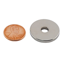 Load image into Gallery viewer, NR010023N Neodymium Ring Magnet - Compared to Penny for Size Reference