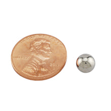 Load image into Gallery viewer, 5XNS25 Neodymium Sphere Magnet - Compared to Penny for Size Reference