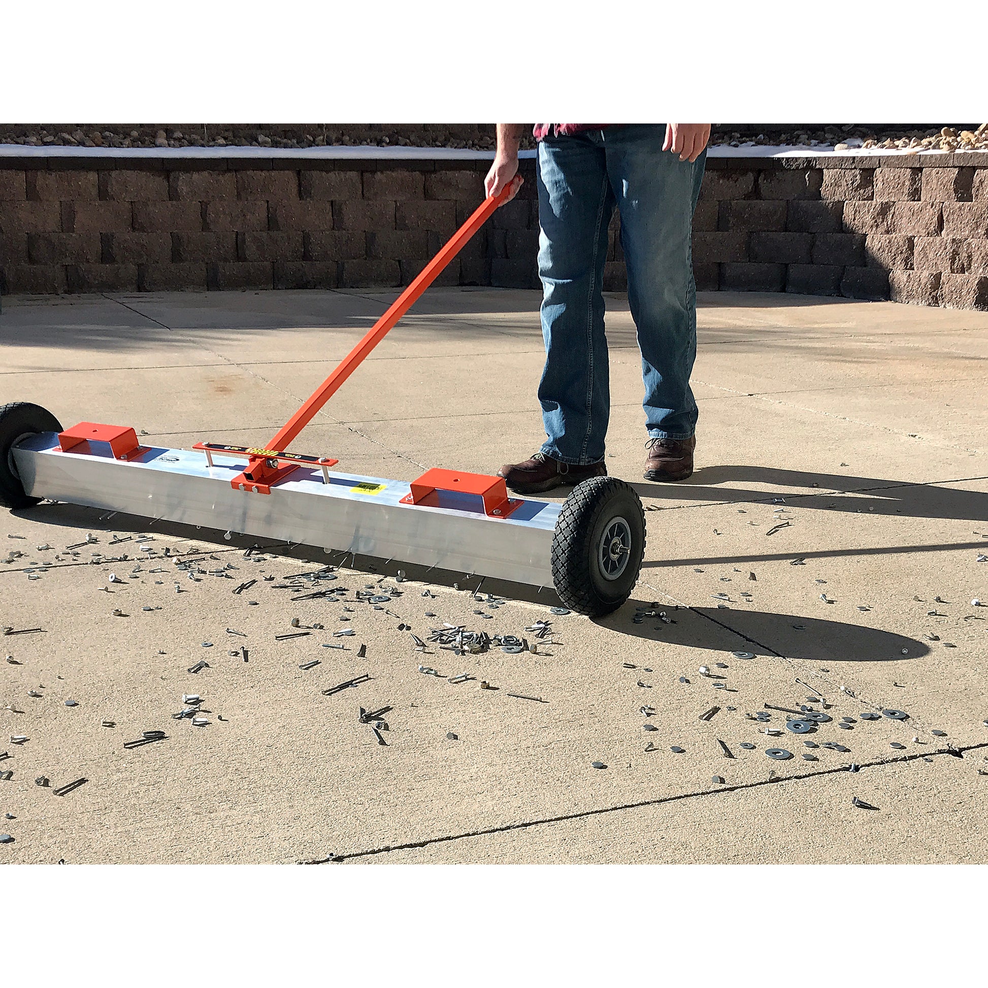 Load image into Gallery viewer, VSM-48 VersaSWEEP™ 4-in-1 Magnetic Sweeper with Quick Release - Man Sweeping Debris off Sidewalk