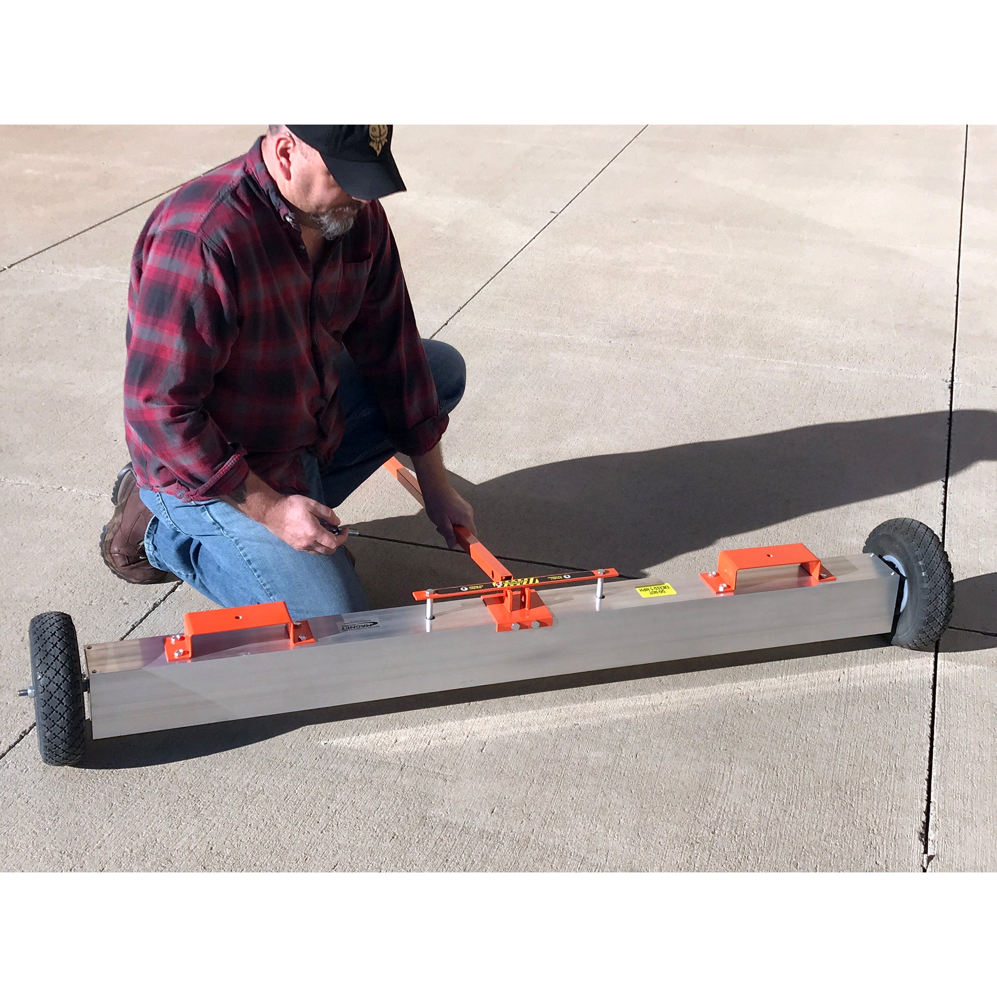 Load image into Gallery viewer, VSM-60 VersaSWEEP™ 4-in-1 Magnetic Sweeper with Quick Release - Man Assembling Sweeper