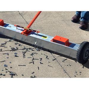 VSM-60 VersaSWEEP™ 4-in-1 Magnetic Sweeper with Quick Release - Closeup View of Sweeper Removing Debris from Sidewalk