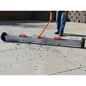 VSM-84 VersaSWEEP™ 4-in-1 Magnetic Sweeper with Quick Release - Pushing Large Debris