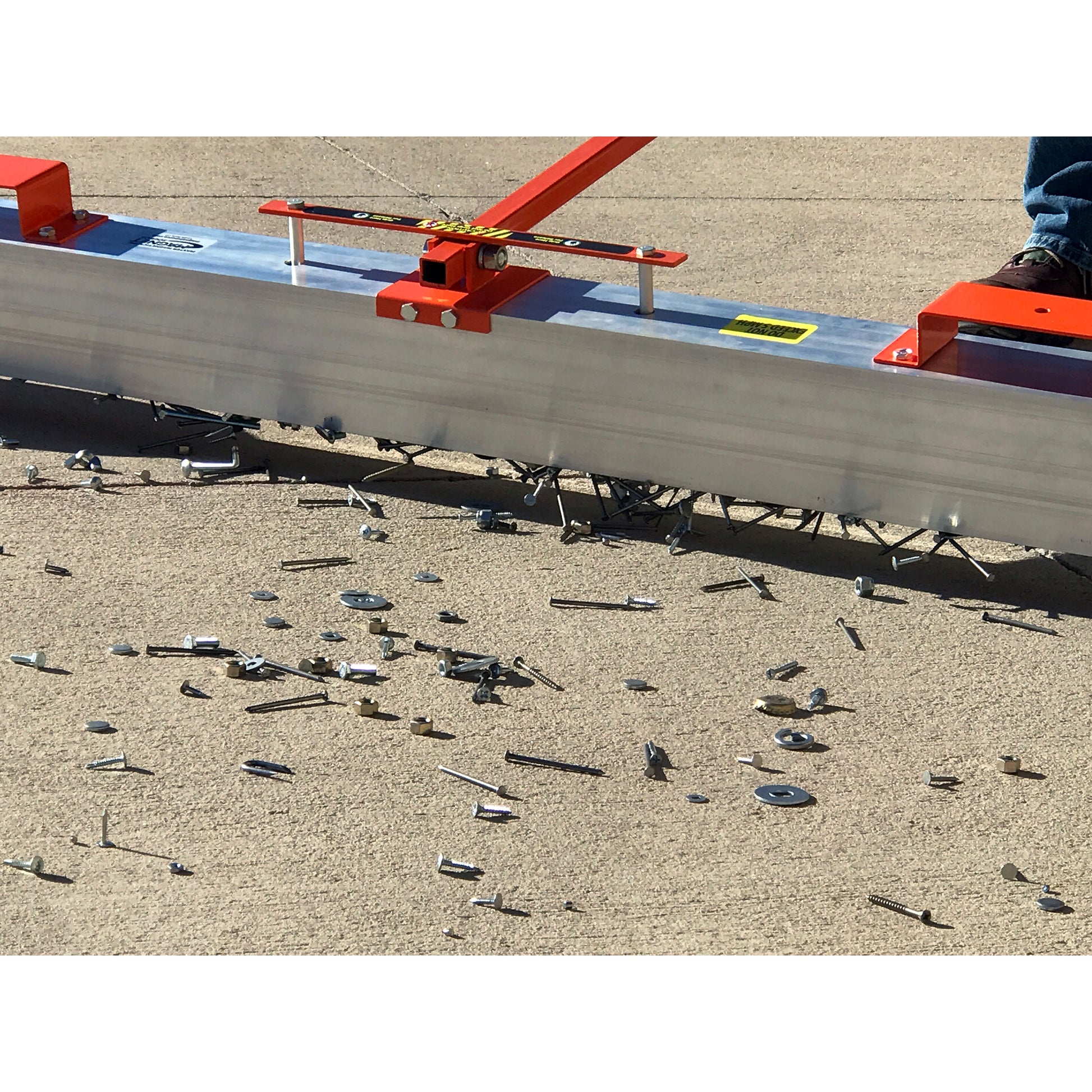 Load image into Gallery viewer, VSM-84 VersaSWEEP™ 4-in-1 Magnetic Sweeper with Quick Release - Closeup of Pushing Large Debris