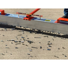 Load image into Gallery viewer, VSM-84 VersaSWEEP™ 4-in-1 Magnetic Sweeper with Quick Release - Closeup of Pushing Large Debris