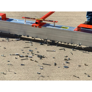 VSM-84 VersaSWEEP™ 4-in-1 Magnetic Sweeper with Quick Release - Closeup of Pushing Large Debris