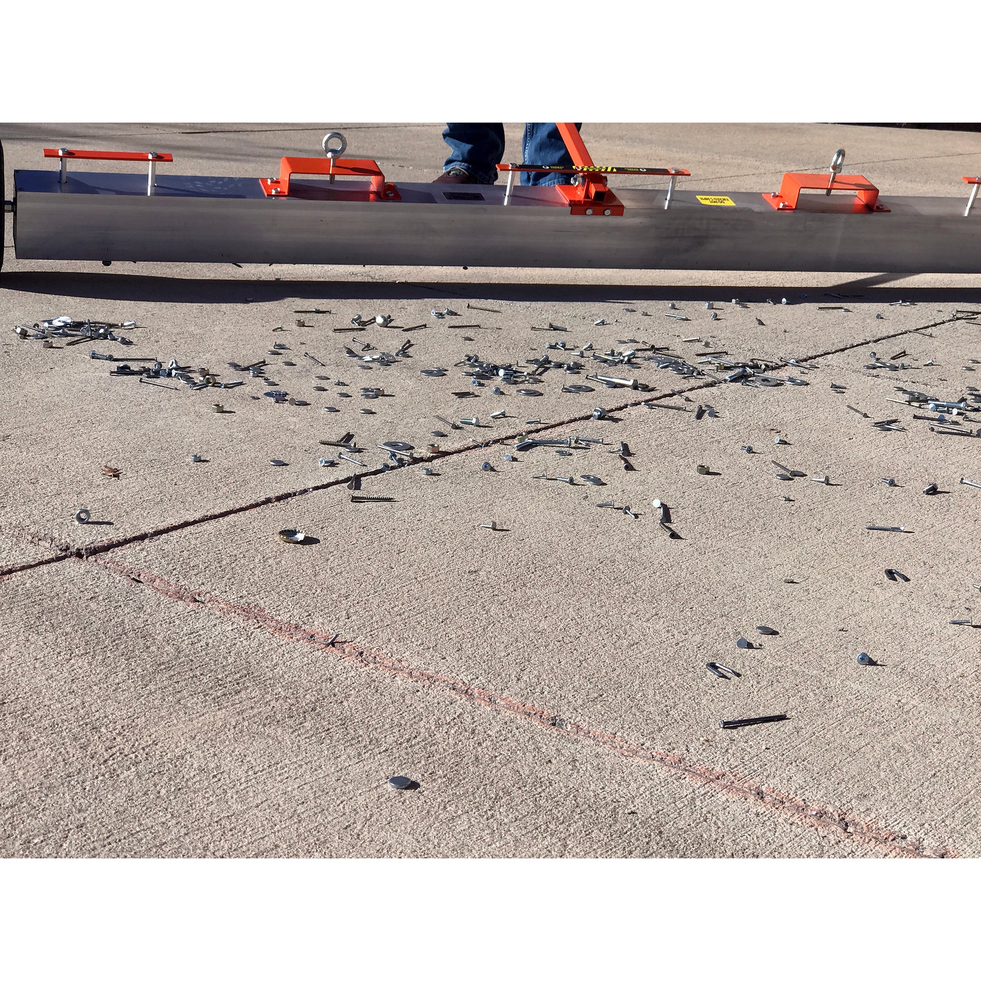 Load image into Gallery viewer, VSM-84 VersaSWEEP™ 4-in-1 Magnetic Sweeper with Quick Release - Closeup of Pushing Large Debris