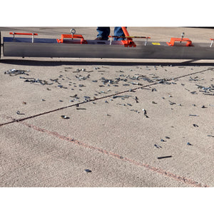 VSM-84 VersaSWEEP™ 4-in-1 Magnetic Sweeper with Quick Release - Closeup of Pushing Large Debris